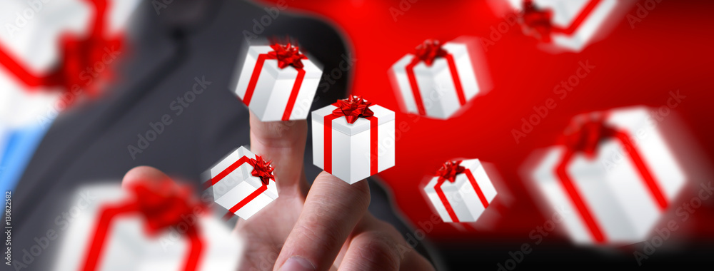 Man celebrating christmas holding gift in his hand