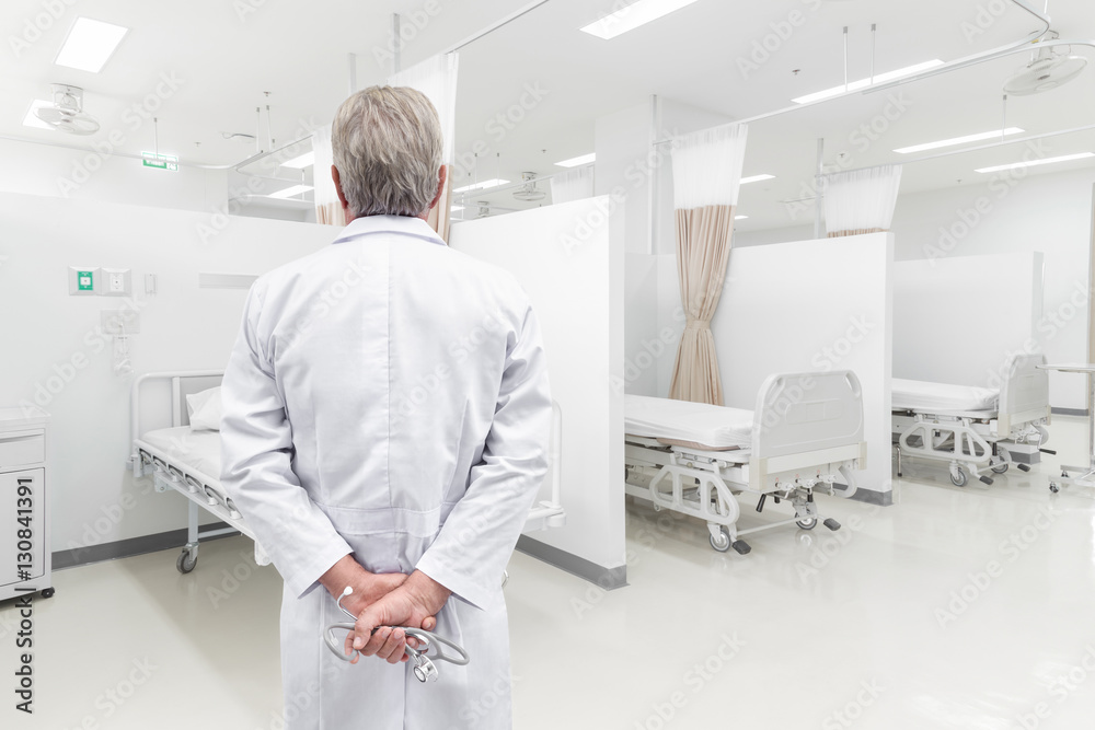 Rear view senior doctor looking at the hospital room