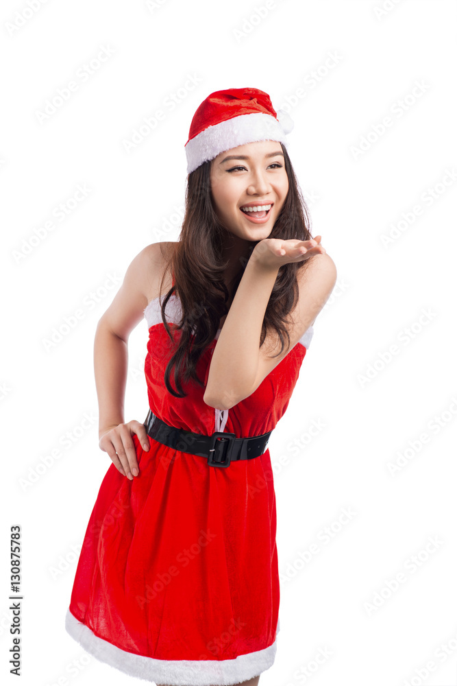 Christmas Woman. Beauty Asian Model Girl in Santa Hat isolated o