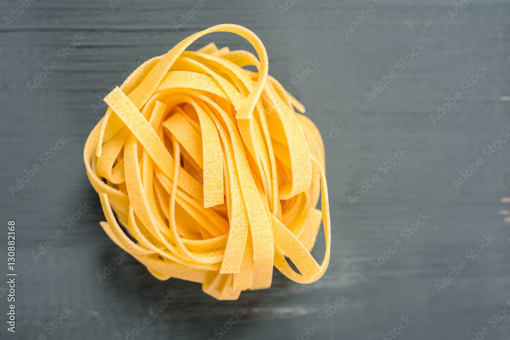 Italian Tagliatelle Pasta On Wood Table