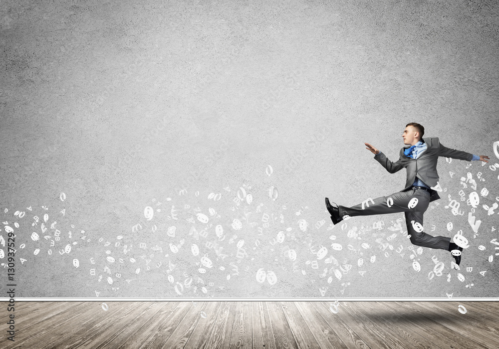 Businessman jumping high