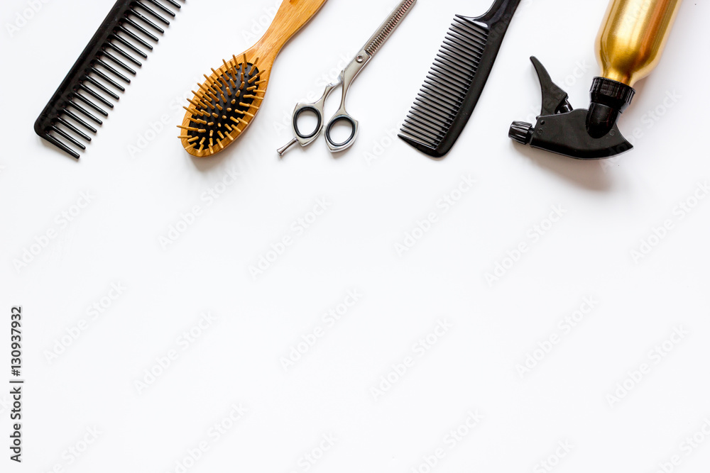 combs and hairdresser tools on white background top view