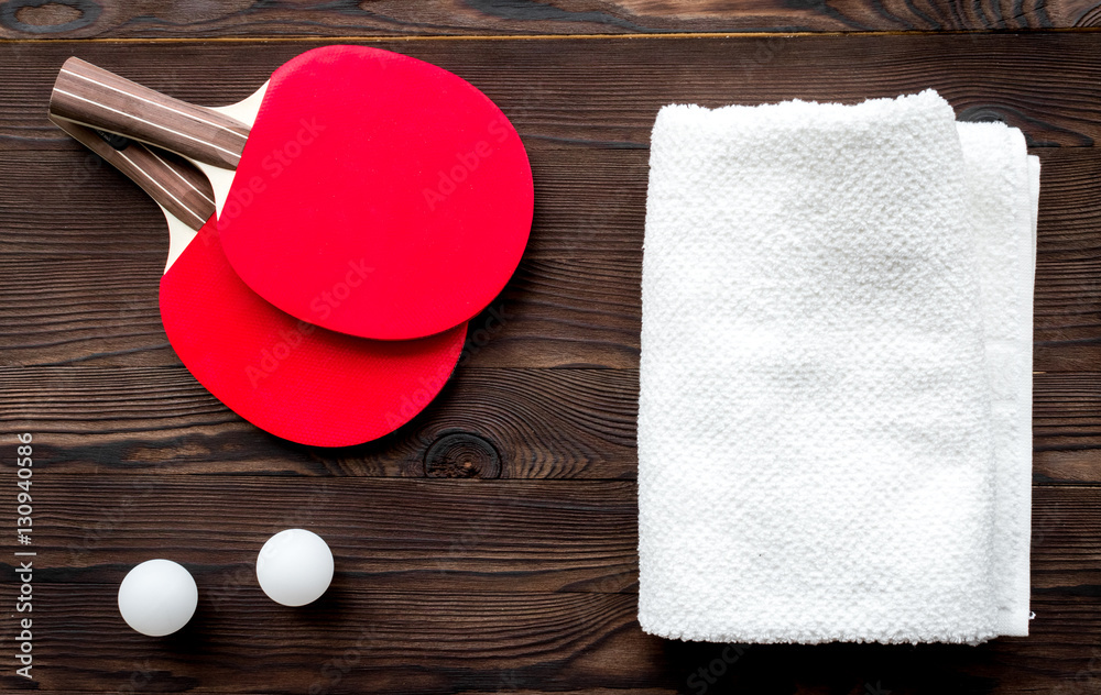 tennis racquet - fitness in the wooden background top view