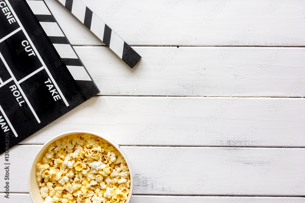 watching movie with popcorn on wooden background top view