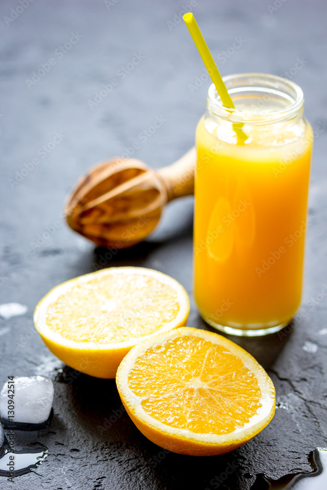 freshly squeezed orange juice on dark background