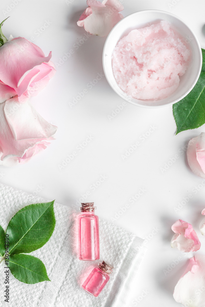 organic cosmetic with rose oil on white background top view