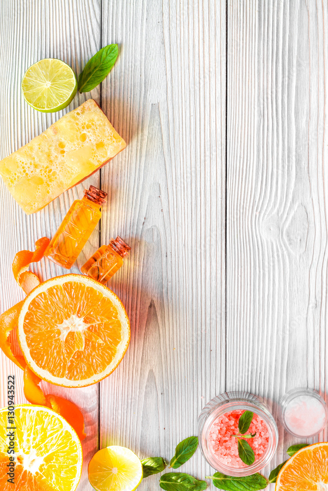 organic cosmetic with citrus on wooden background top view