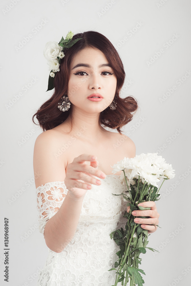 Beautiful asian woman bride on grey background