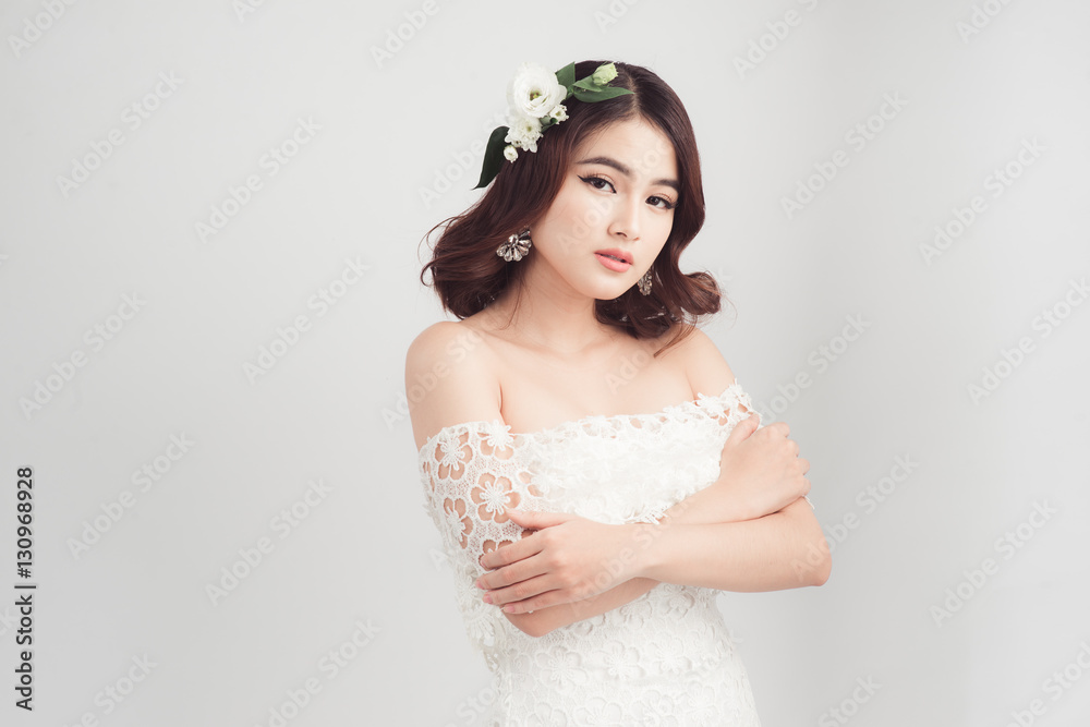 Beautiful asian woman bride on grey background