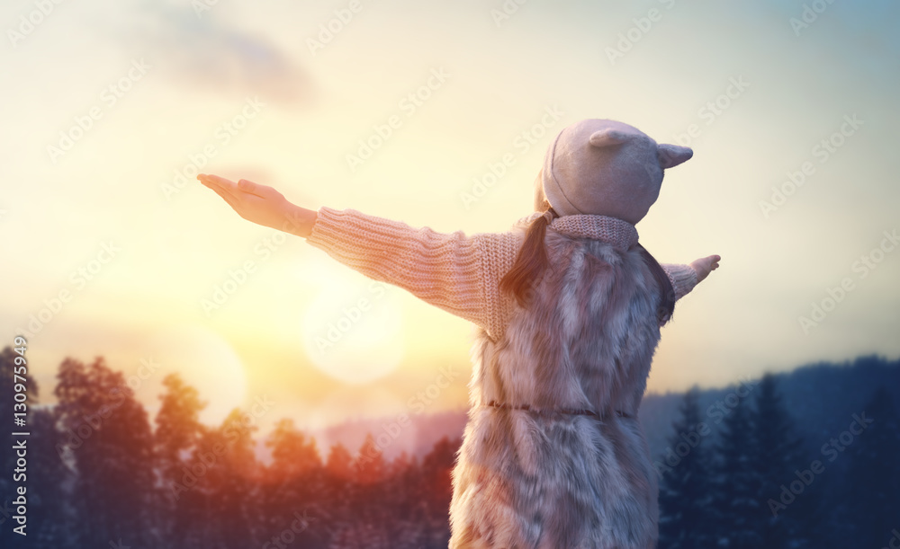 girl playing on a winter walk