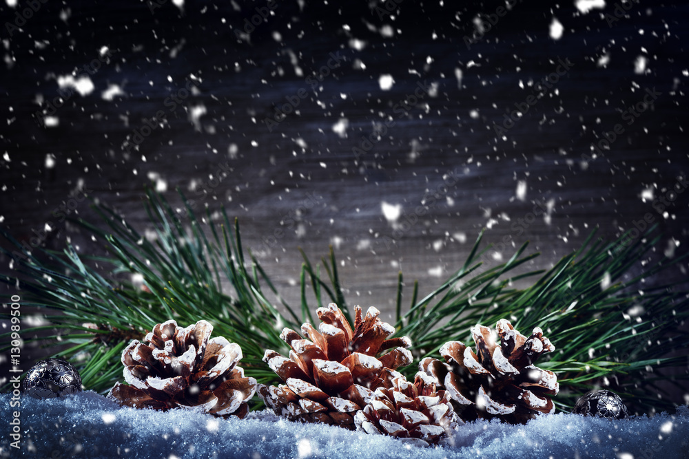 Christmas holiday setting with pine cones and fir tree branches