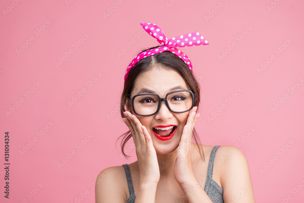 Fashion portrait of asian girl with sunglasses standing on pink