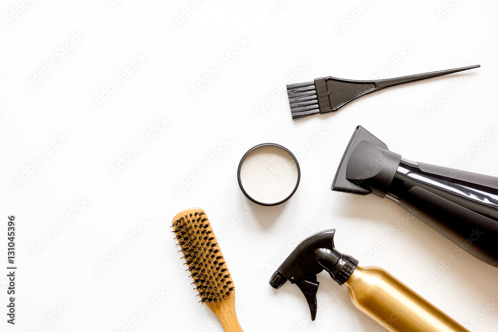 combs and hairdresser tools on white background top view