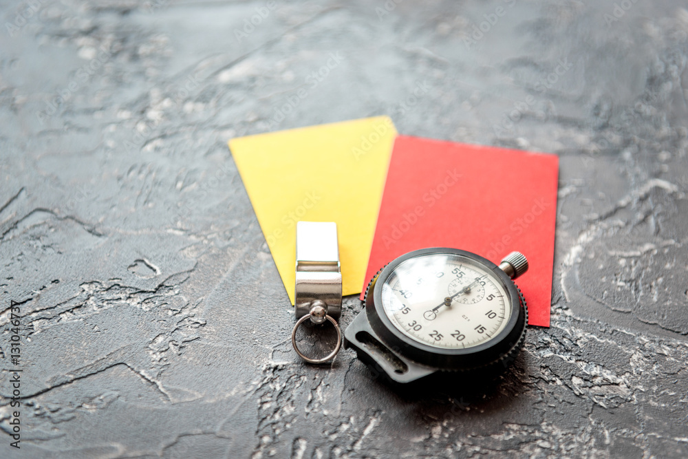 red and yellow cards on dark background close up