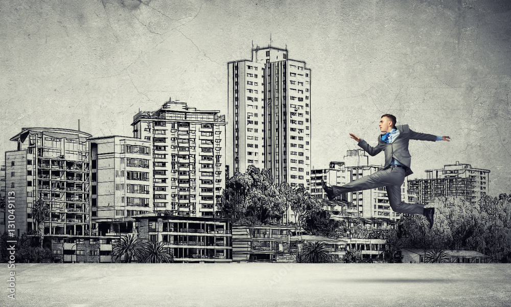 Businessman jumping high