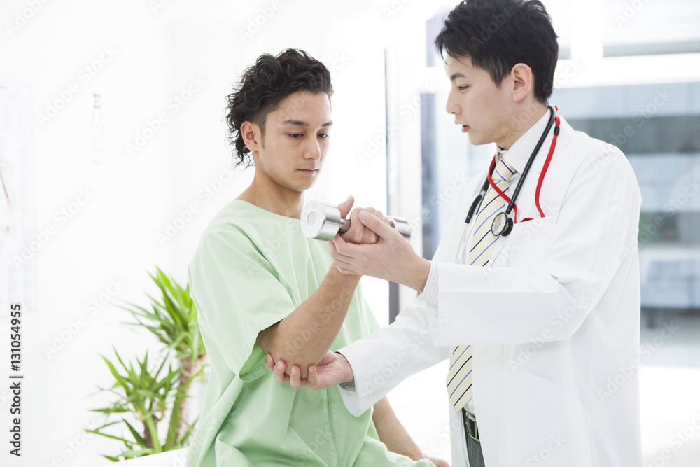 Men are rehabilitating their arms with dumbbells at the hospital