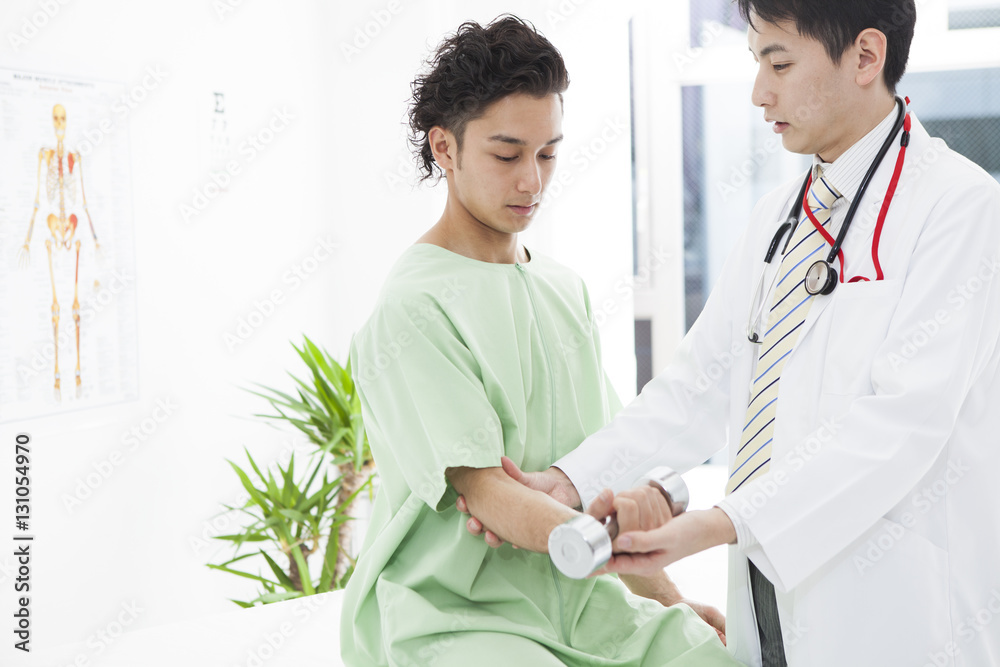 Men are rehabilitating their arms with dumbbells at the hospital