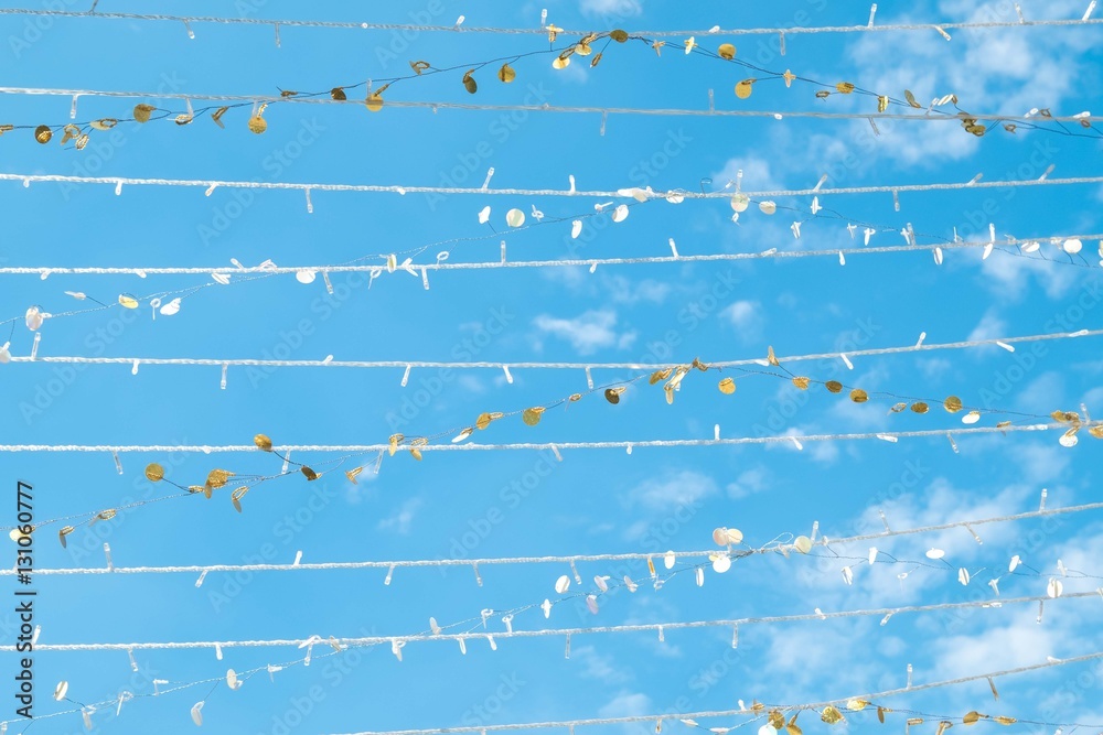 Light bulbs on string wire against the sky. Good life or success