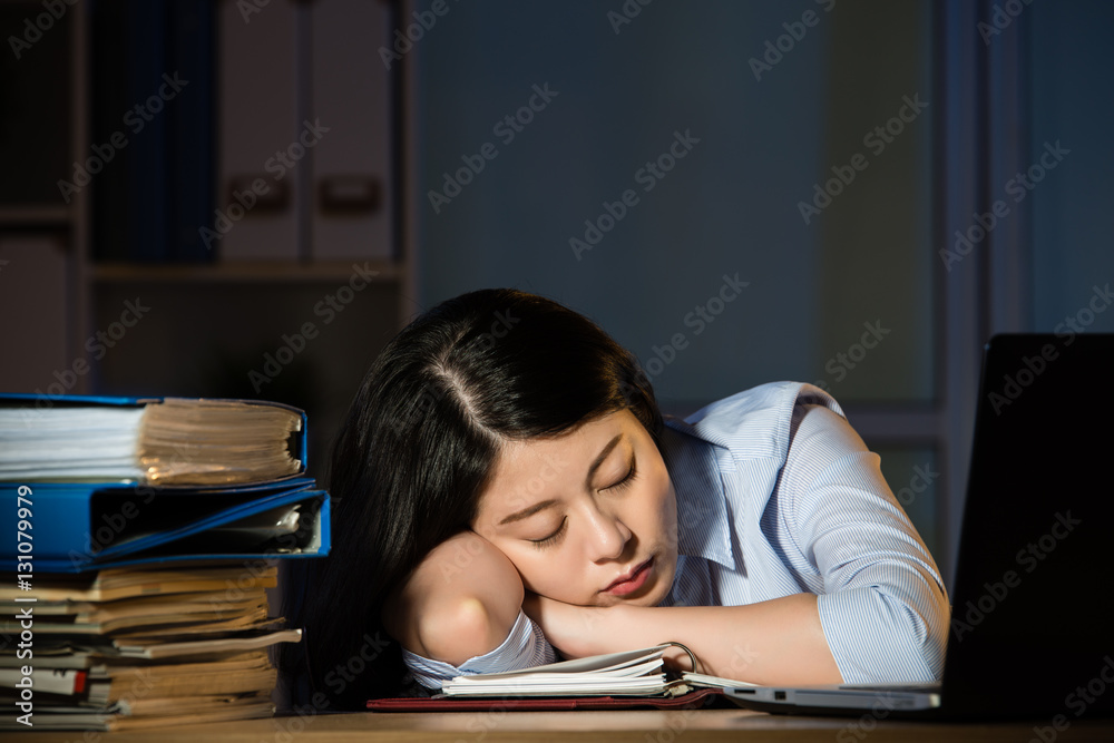 asian business woman sleepy working overtime late night