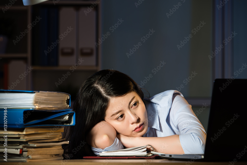 asian business woman sleepy working overtime late night