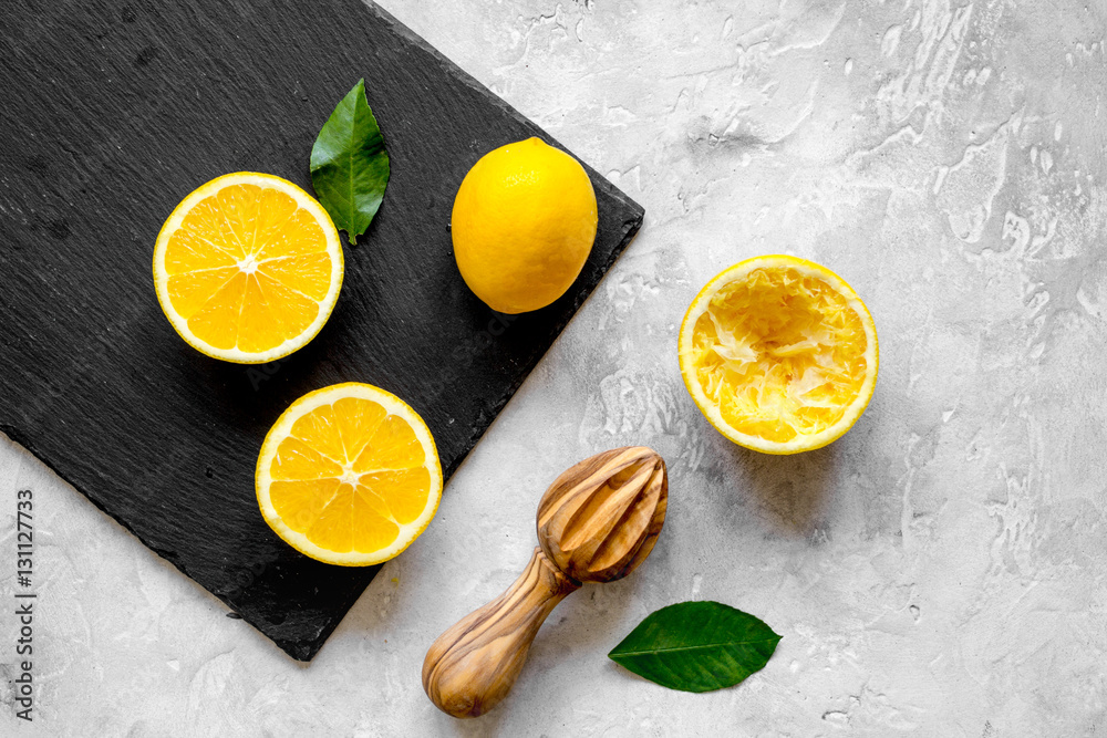 freshly squeezed orange juice on concrete background top view