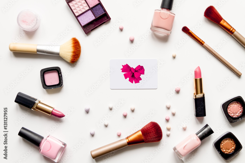 concept online shopping cosmetics on white background top view