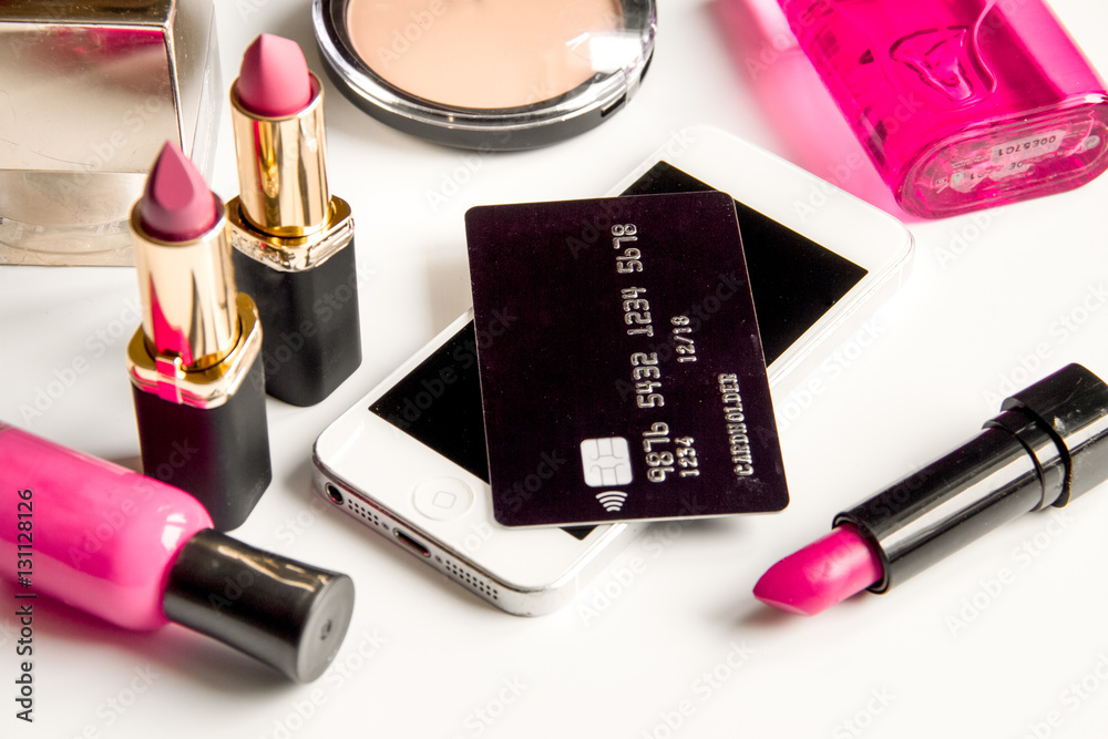 concept online shopping cosmetics on white background