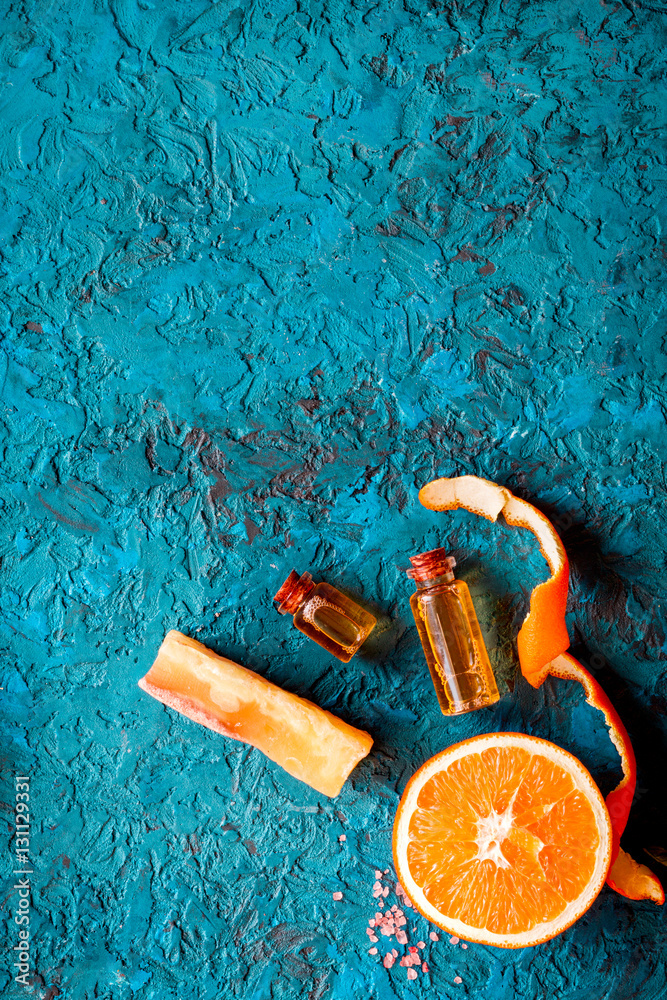 organic cosmetic with citrus on blue background top view