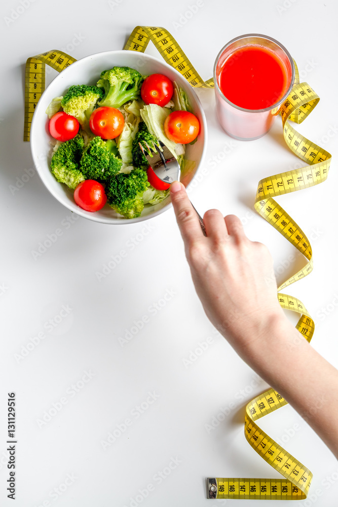 concept slimming diet fresh vegetables on white background top view