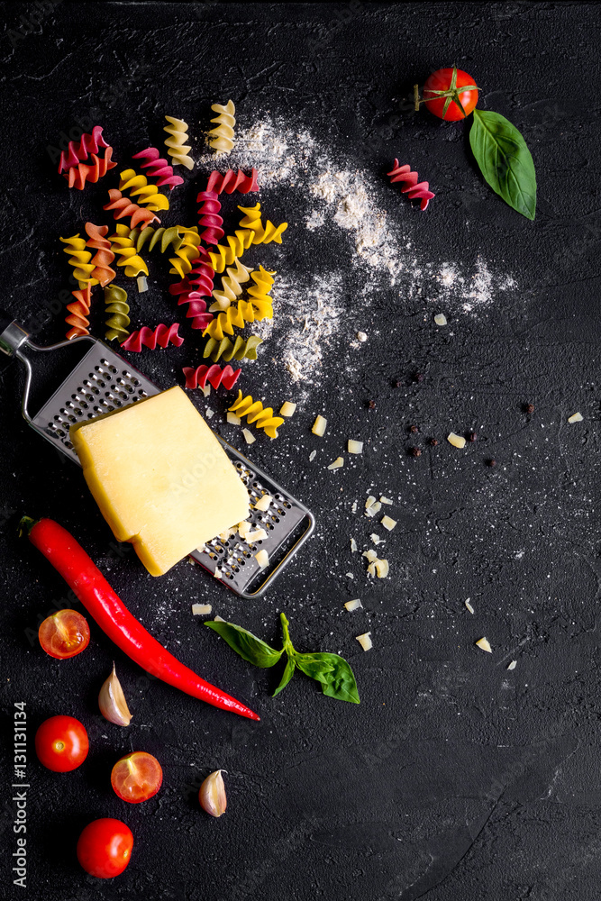 ingredients for cooking paste on dark background top view