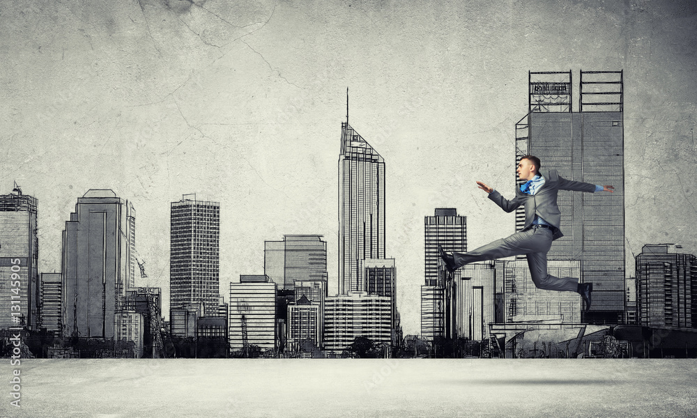 Businessman jumping high