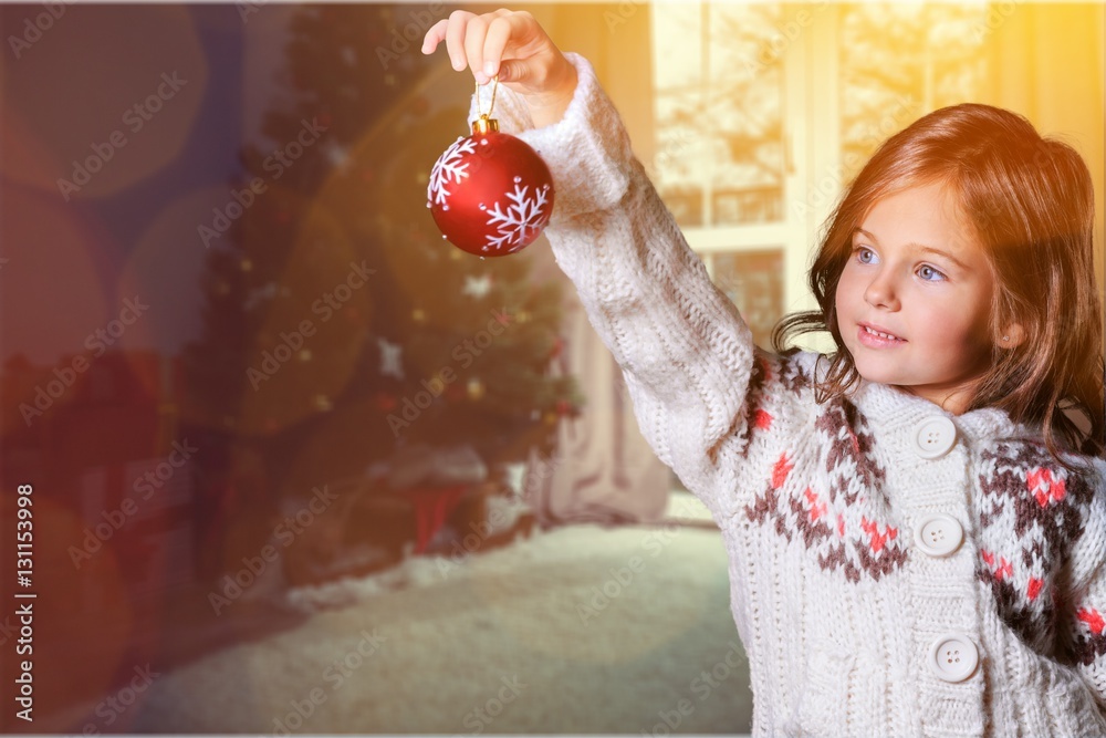 Little girl decorating.