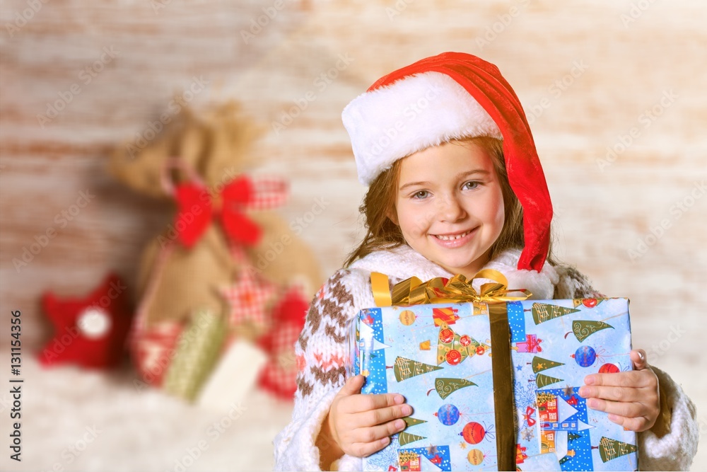 Child giving a christmas present.