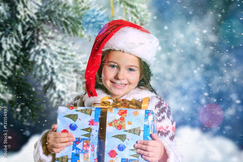 Child giving a christmas present.