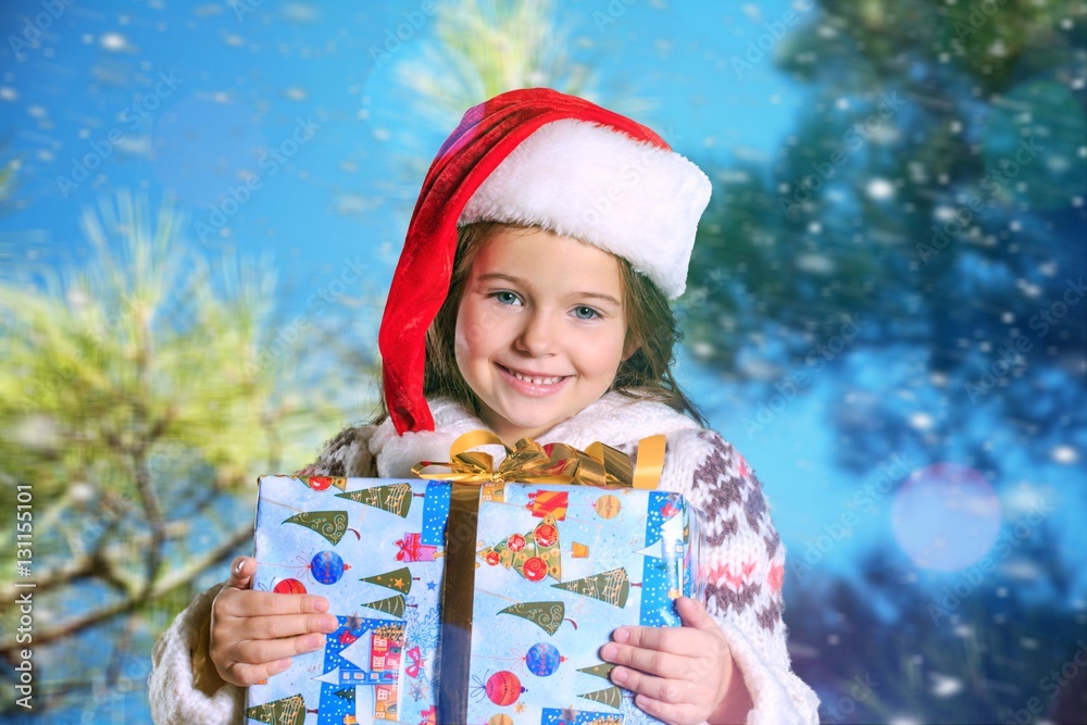 Child giving a christmas present.