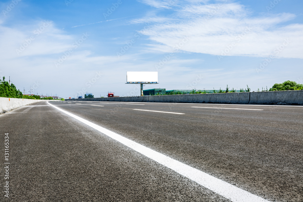 Asphalt road under the blue sky