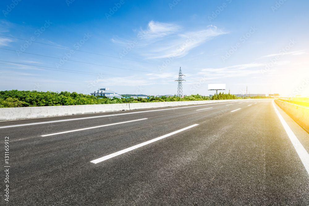 Asphalt road under the blue sky