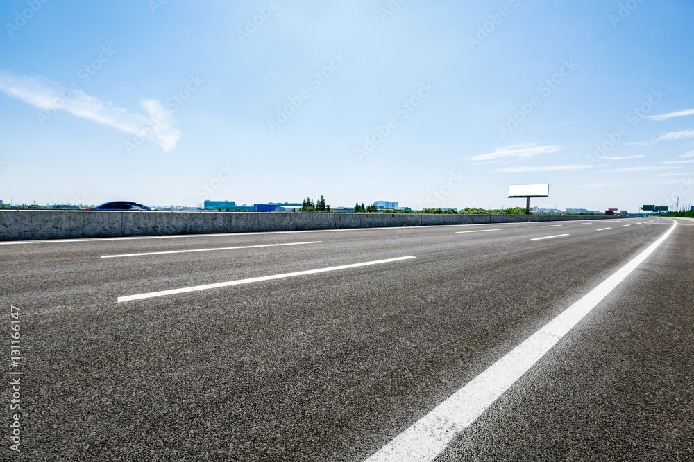 Asphalt road under the blue sky