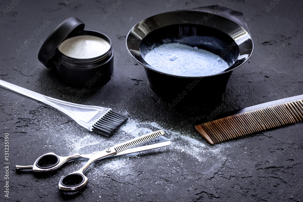 hair dye with brush on dark background