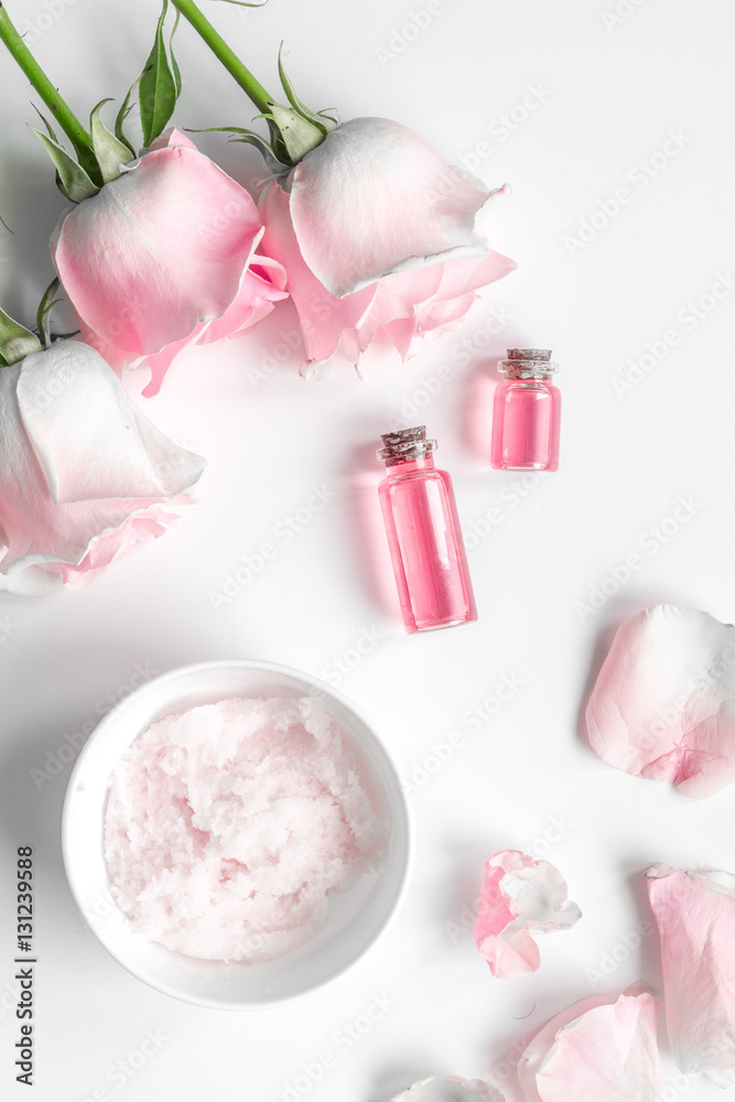 organic cosmetic with rose oil on white background top view