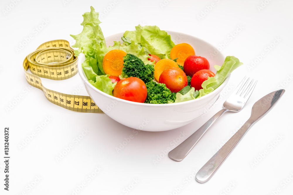 concept diet fresh vegetables on plate at white background