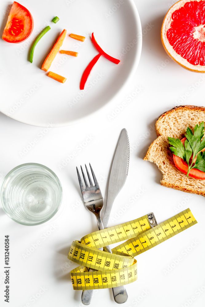 concept slimming diet fresh vegetables on white background top view