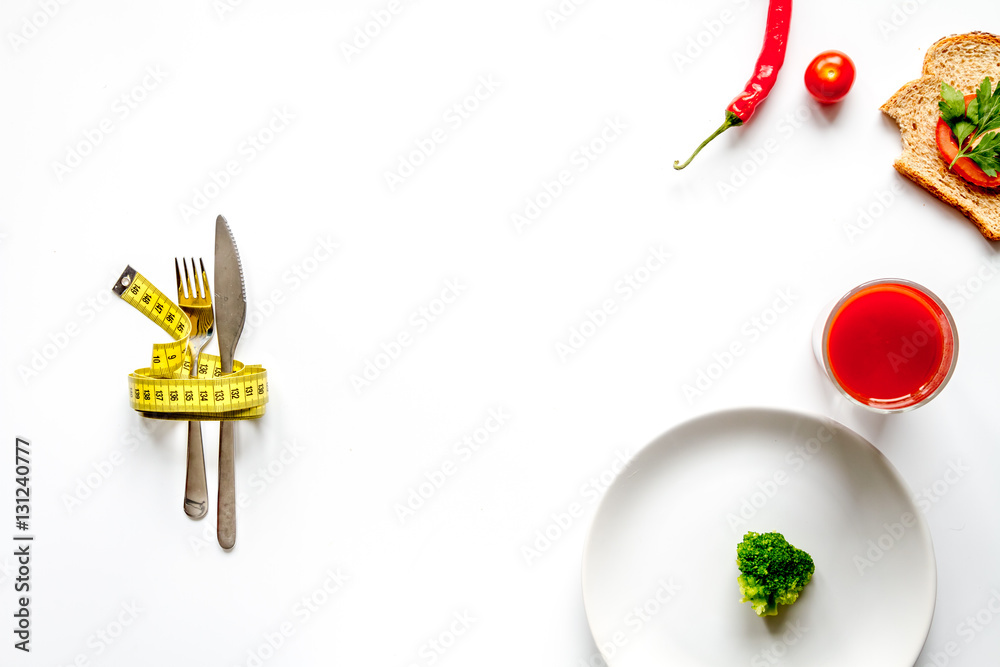 concept slimming diet fresh vegetables on white background top view