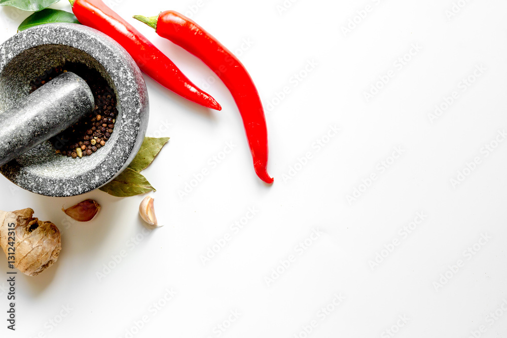 spices and stone mortar white background top view mock up