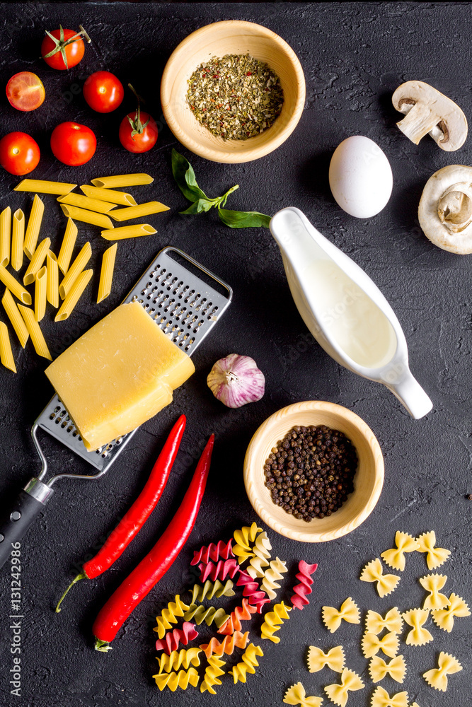 ingredients for cooking paste on dark background top view