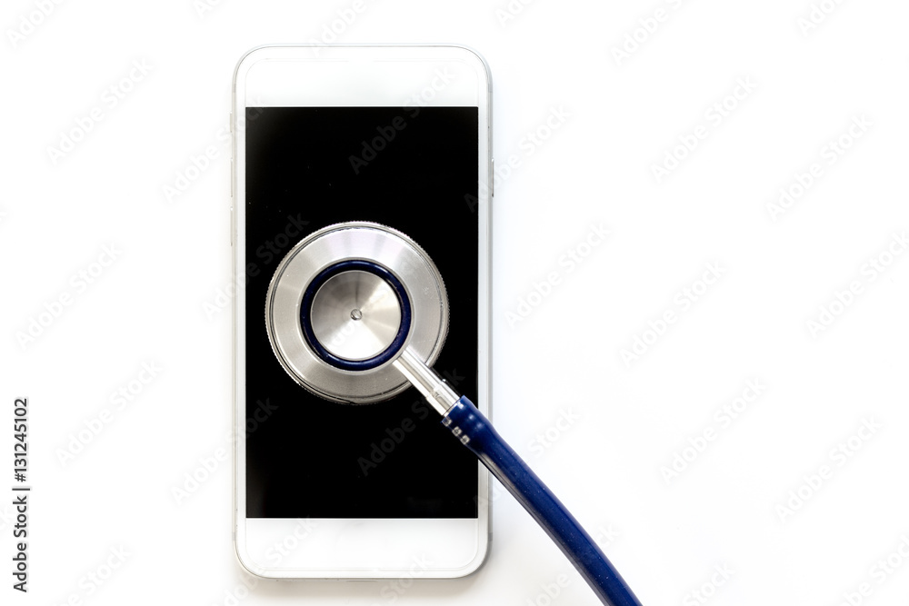 diagnostic of gadgets on white background with stethoscope top view