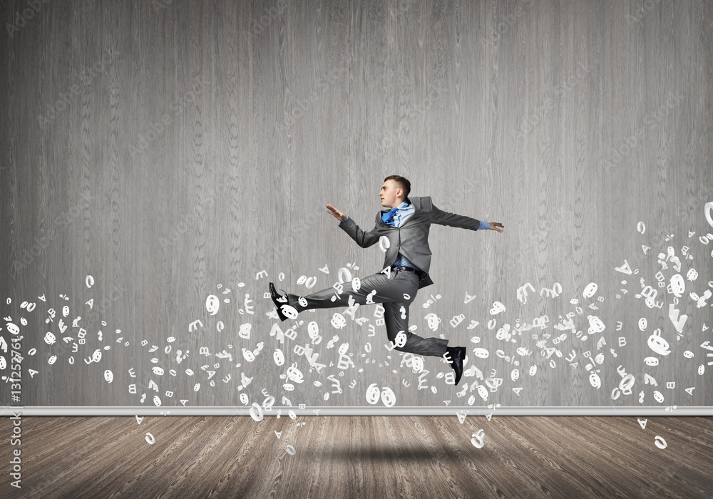 Businessman jumping high