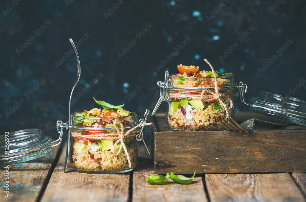 Homemade jar quinoa salad with cherry and sun-dried tomatoes, avocado and fresh basil. Detox, dietin