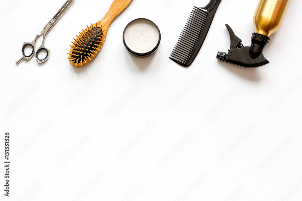 combs and hairdresser tools on white background top view