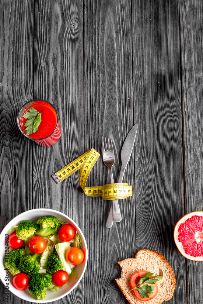 concept slimming diet fresh vegetables on wooden background top view